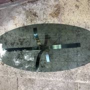 Oval smoked glass coffee table from the 1970s.