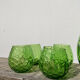 4 green water glasses and vintage blown glass carafe