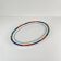Oval porcelain plate by Van Well, multicoloured geometric border, 1980.