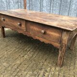 Old coffee table from the Guérandais region in solid oak with 2 front drawers