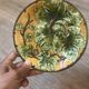 Four antique dessert plates in majolica with vine decoration.