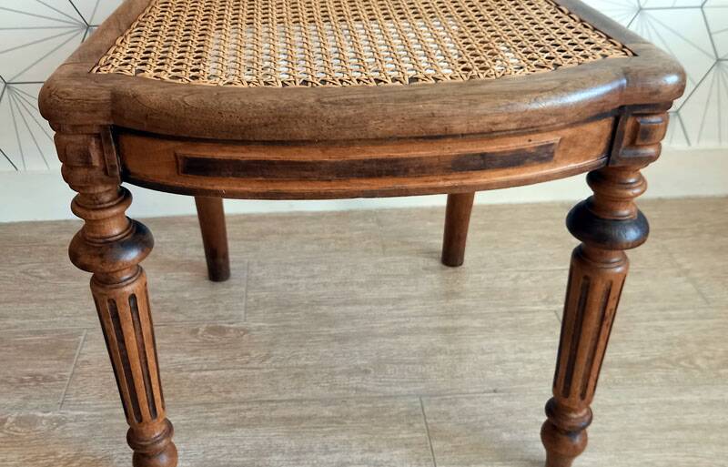 Solid oak art deco chair with cane and fabric.