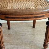 Solid oak art deco chair with cane and fabric.