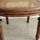 Solid oak art deco chair with cane and fabric.