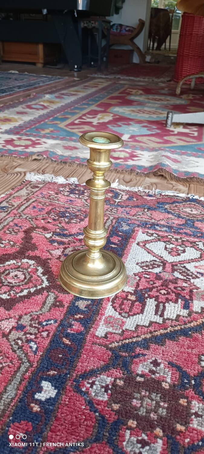 Bronze candlestick or torch holder from the Louis XIV period, France, 17th century.