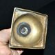 Antique baluster candlestick in bronze with hand-chiseled design.