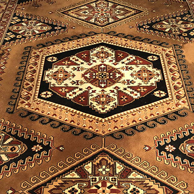 Wool carpet with oriental decoration on a brown background
