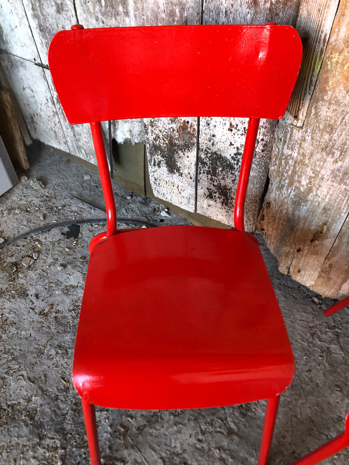 Set of 4 red metal chairs