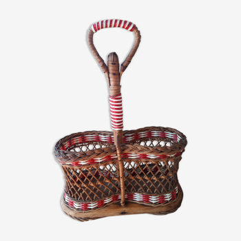Bottle holder in braided wicker, rattan and scoubidou