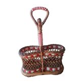 Bottle holder in braided wicker, rattan and scoubidou