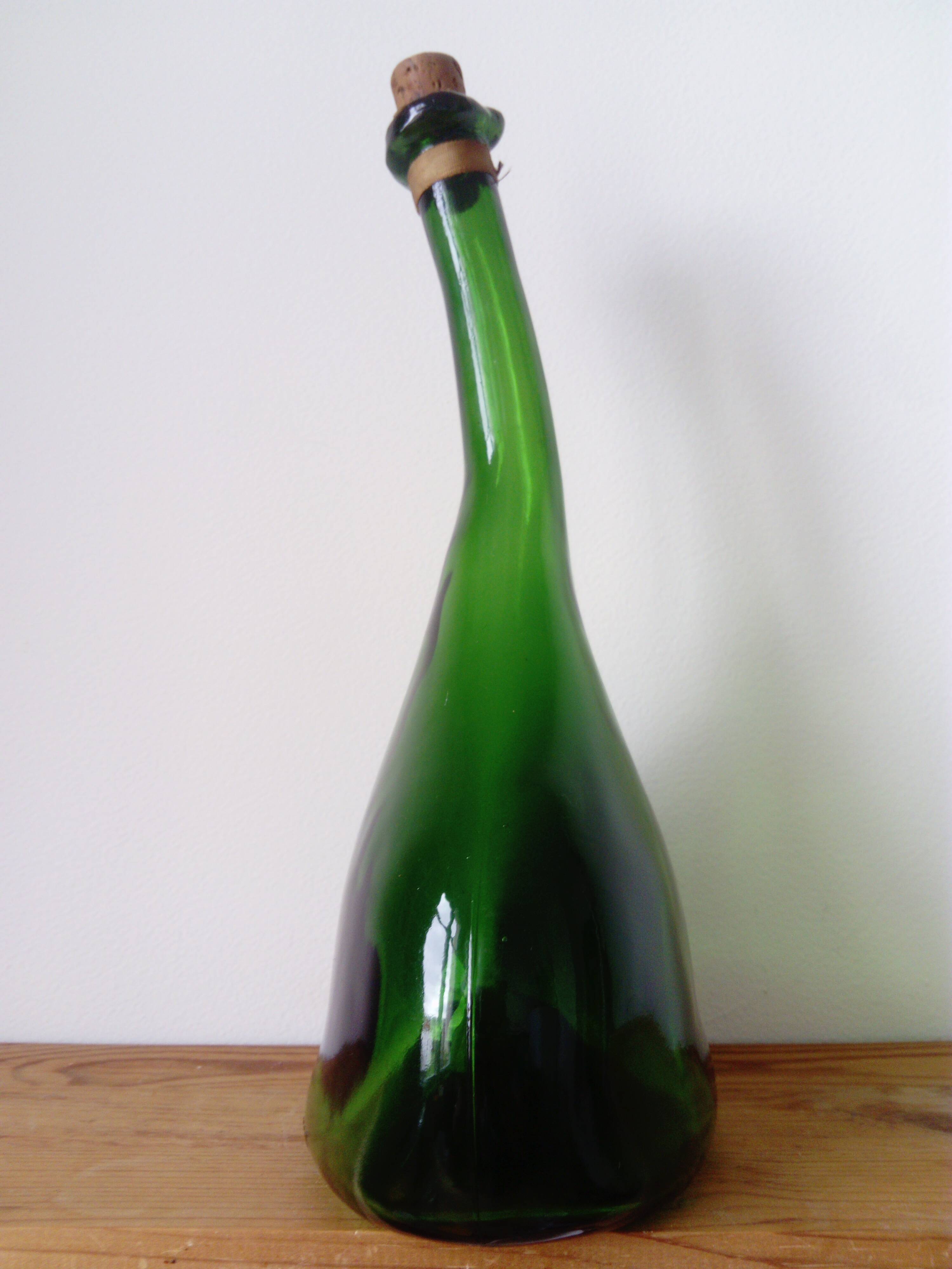 Old blown glass bottle, free form. Armagnac