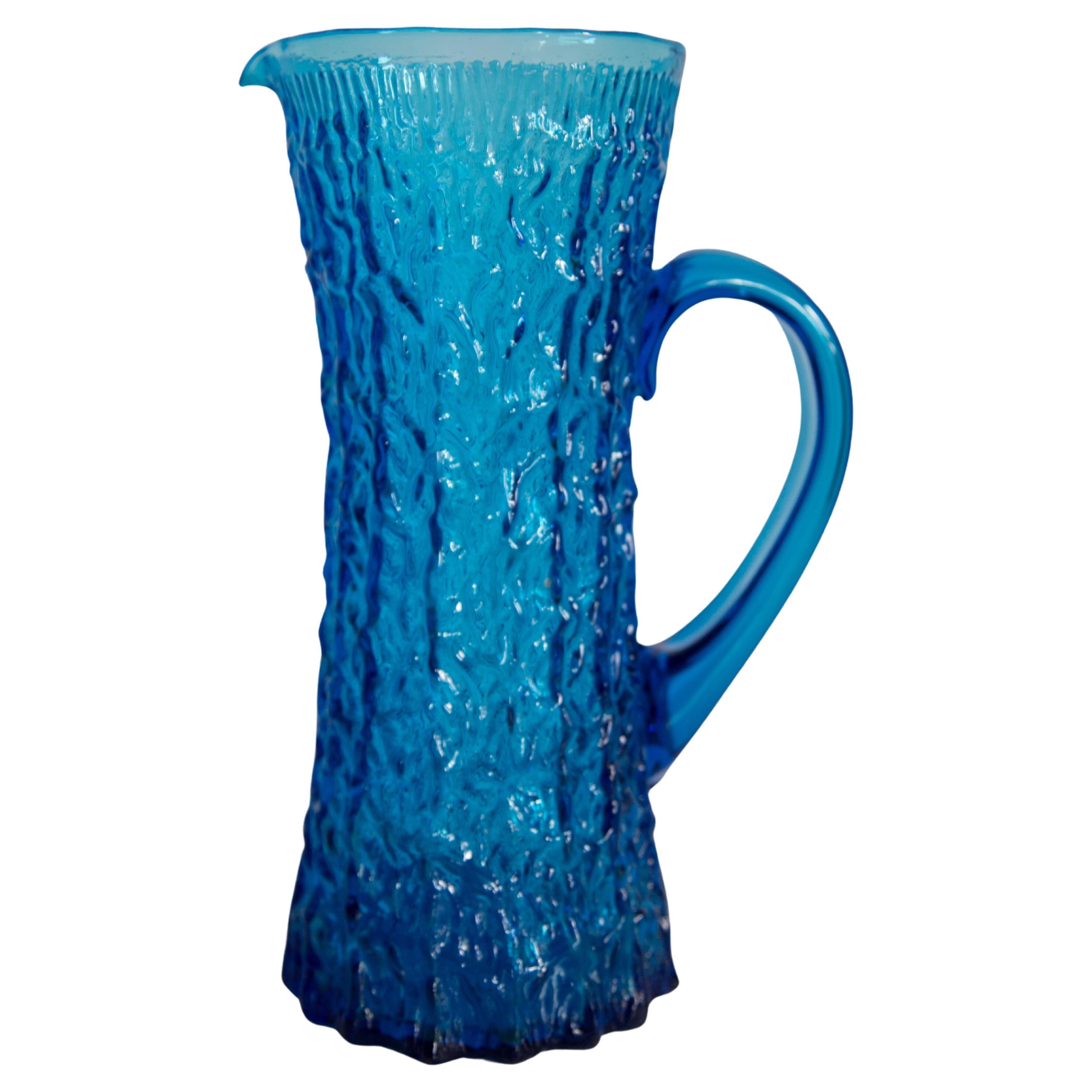 Blue glass water or juice pitcher from the mid-20th century.