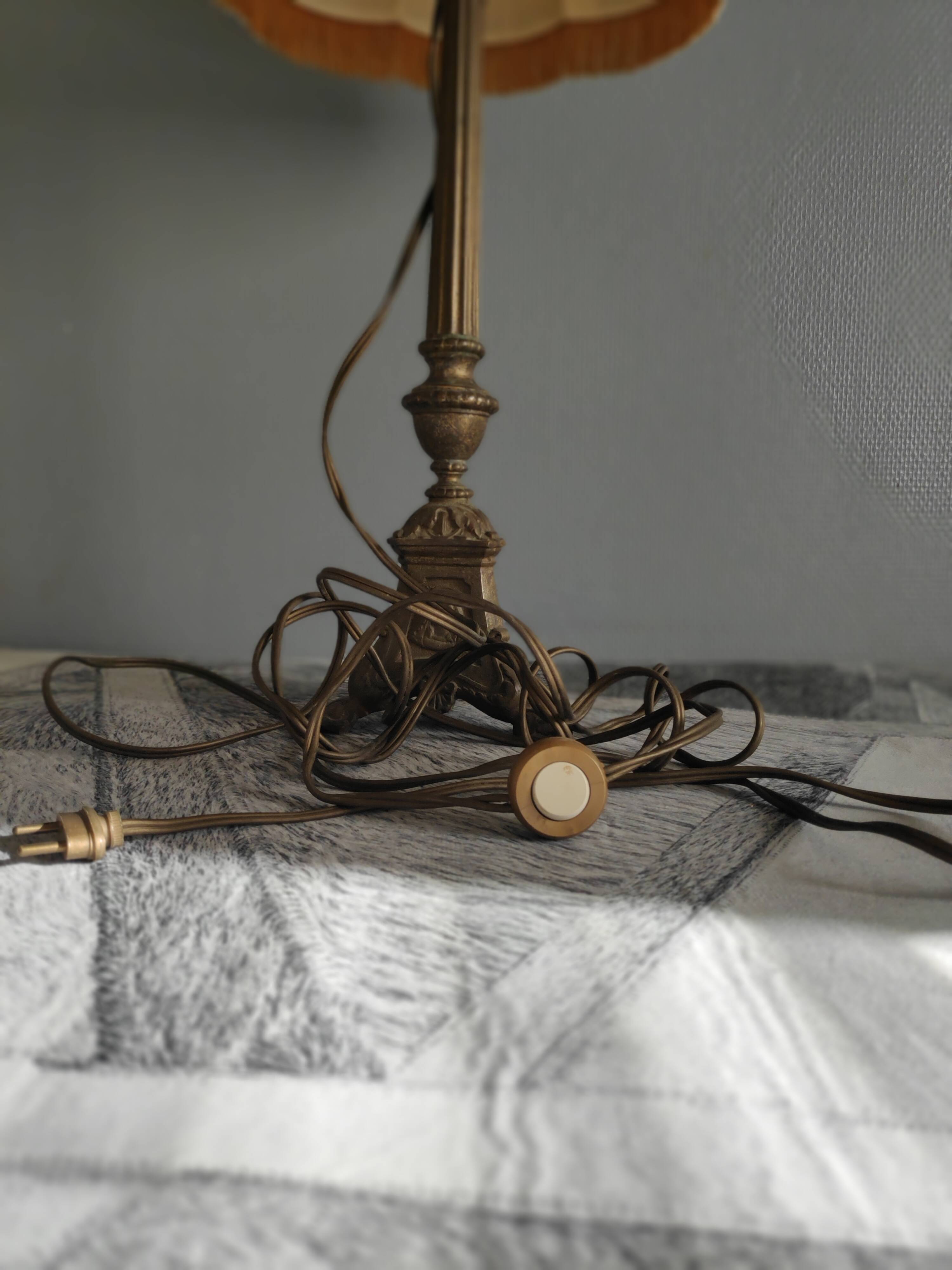 Old brass foot lamp and period lampshade