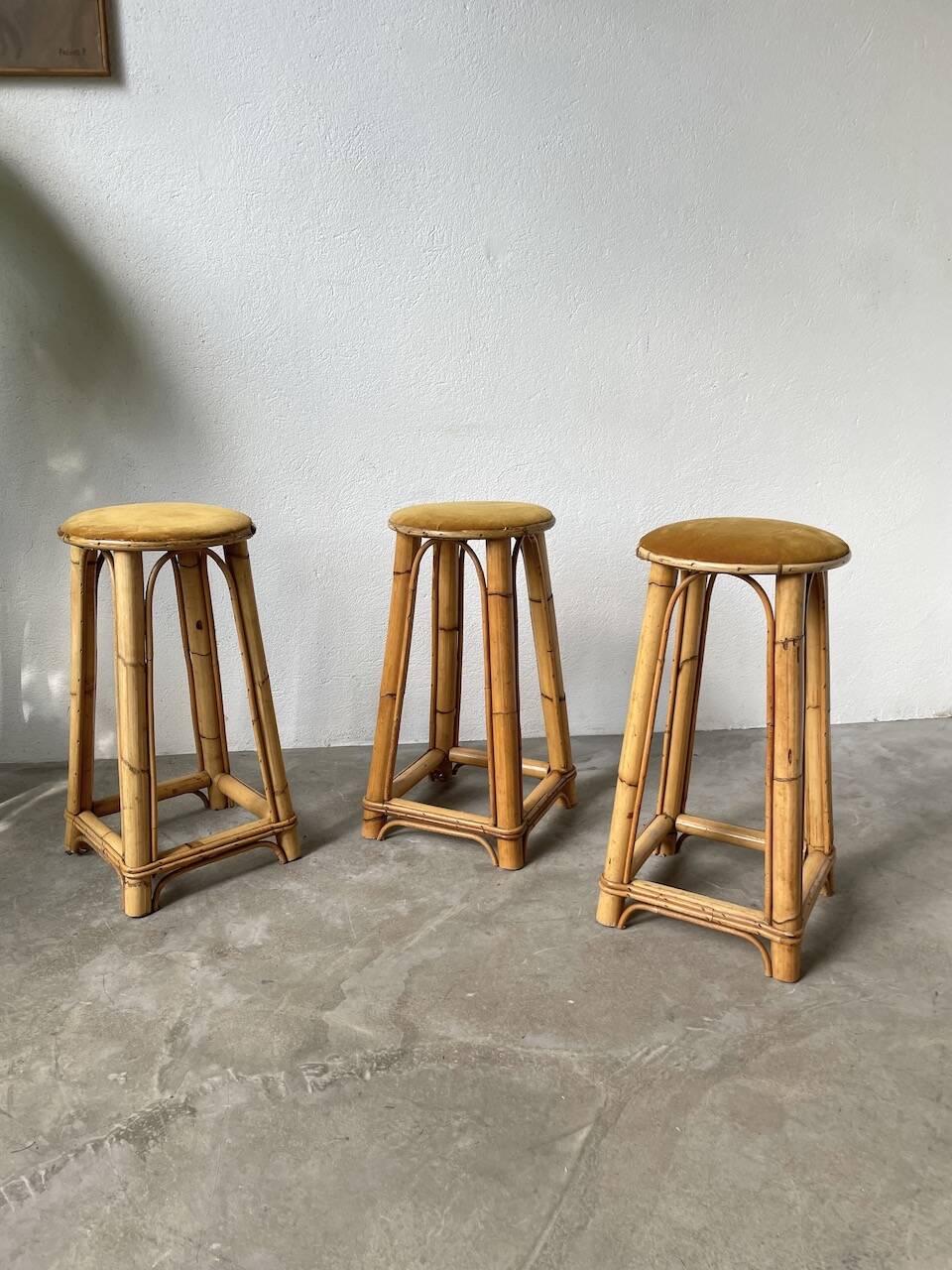 Set of three rattan high stools