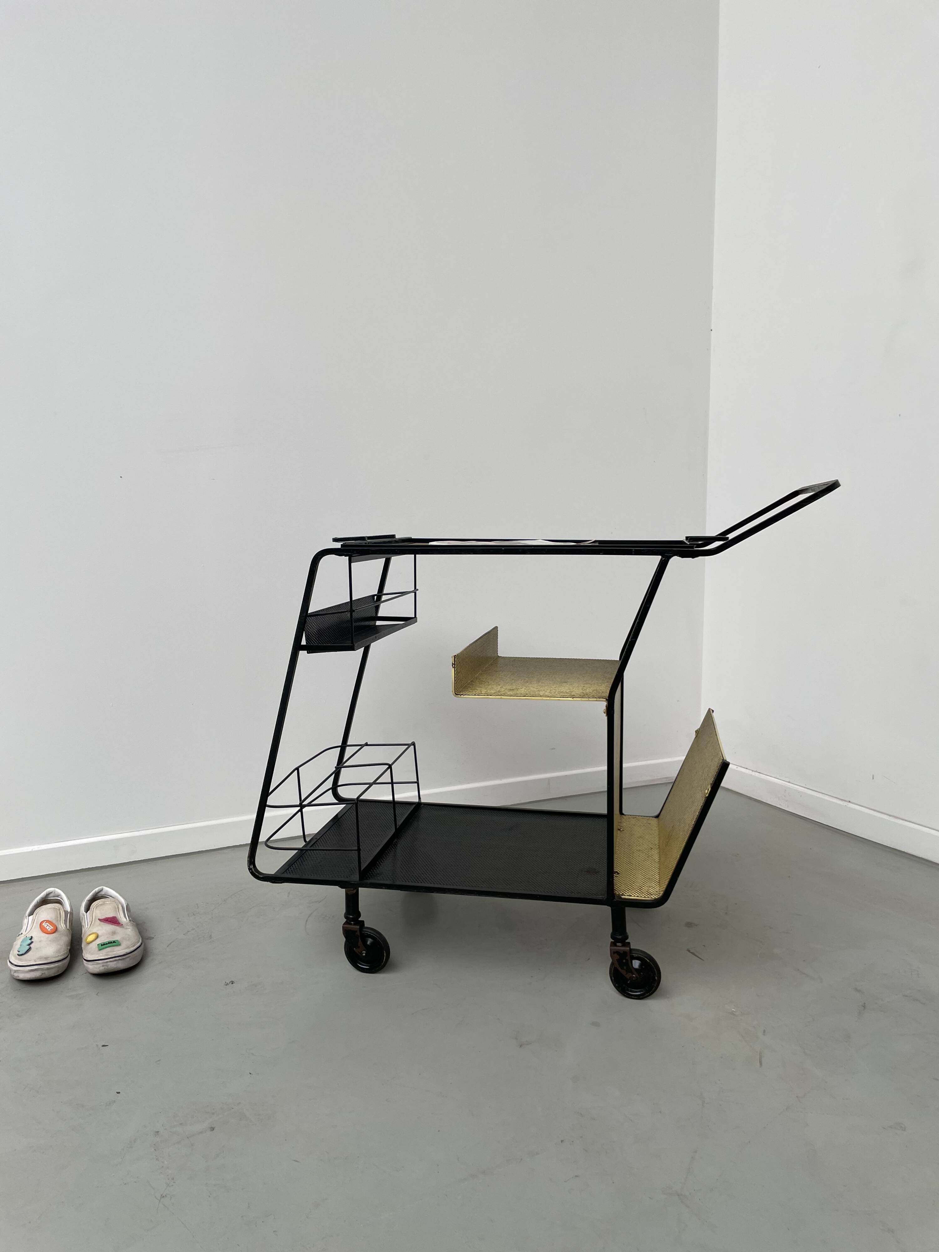 Perforated metal serving trolley in the Mathieu Matégot style