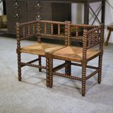 Pair of turned wooden corner chairs from the 1950s.