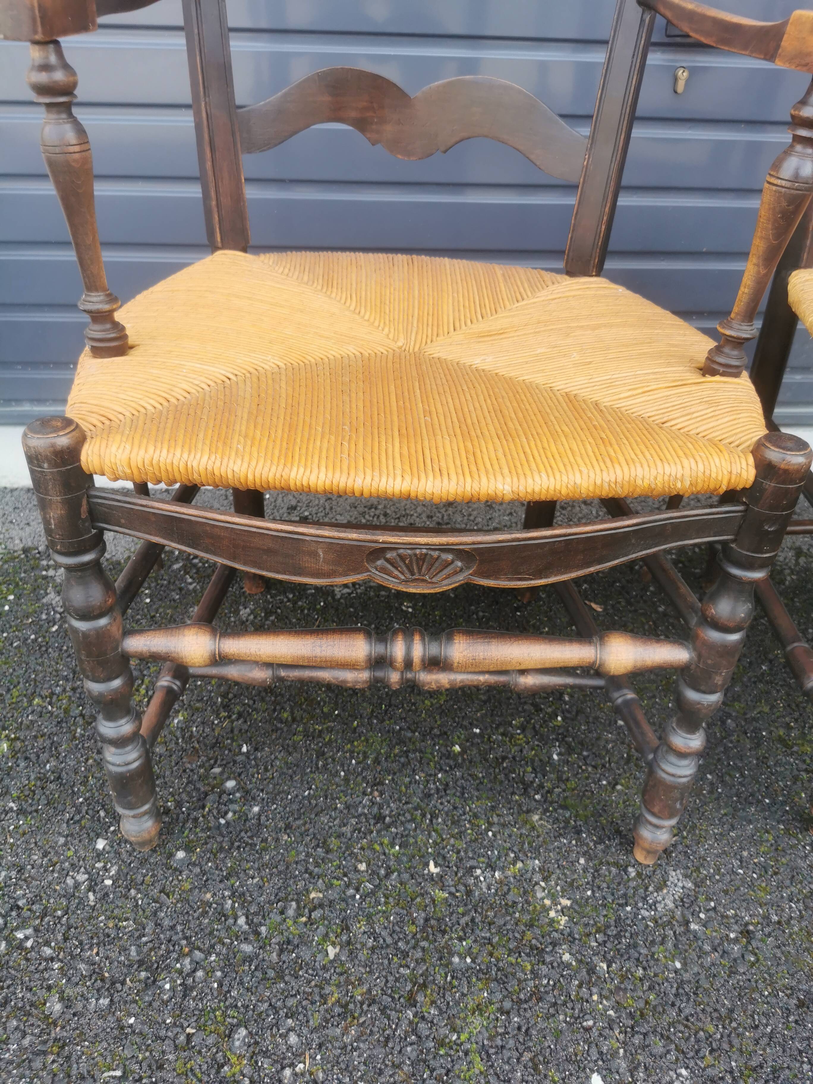Pair of blackened wooden armchairs