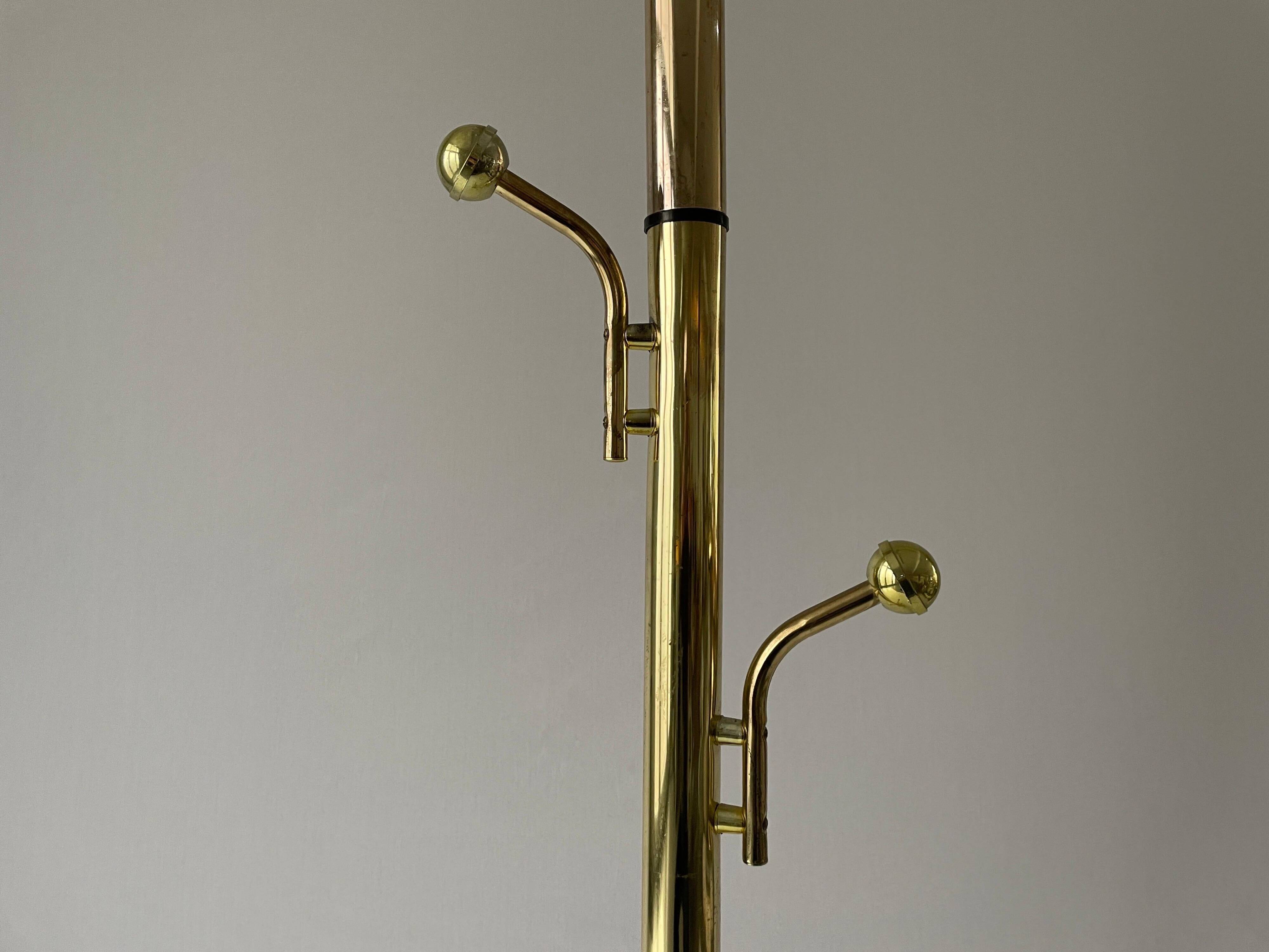 Free-standing coat rack in plexiglass with a marble base, 1960s, Germany.