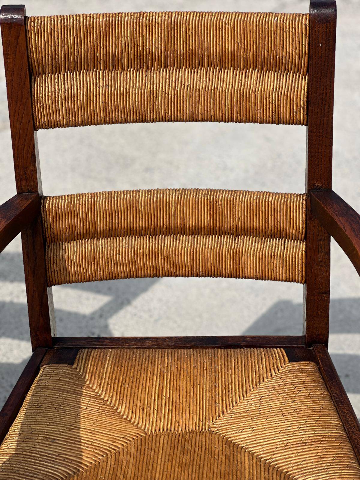 Pair of stained oak and straw armchairs, French work, 1950