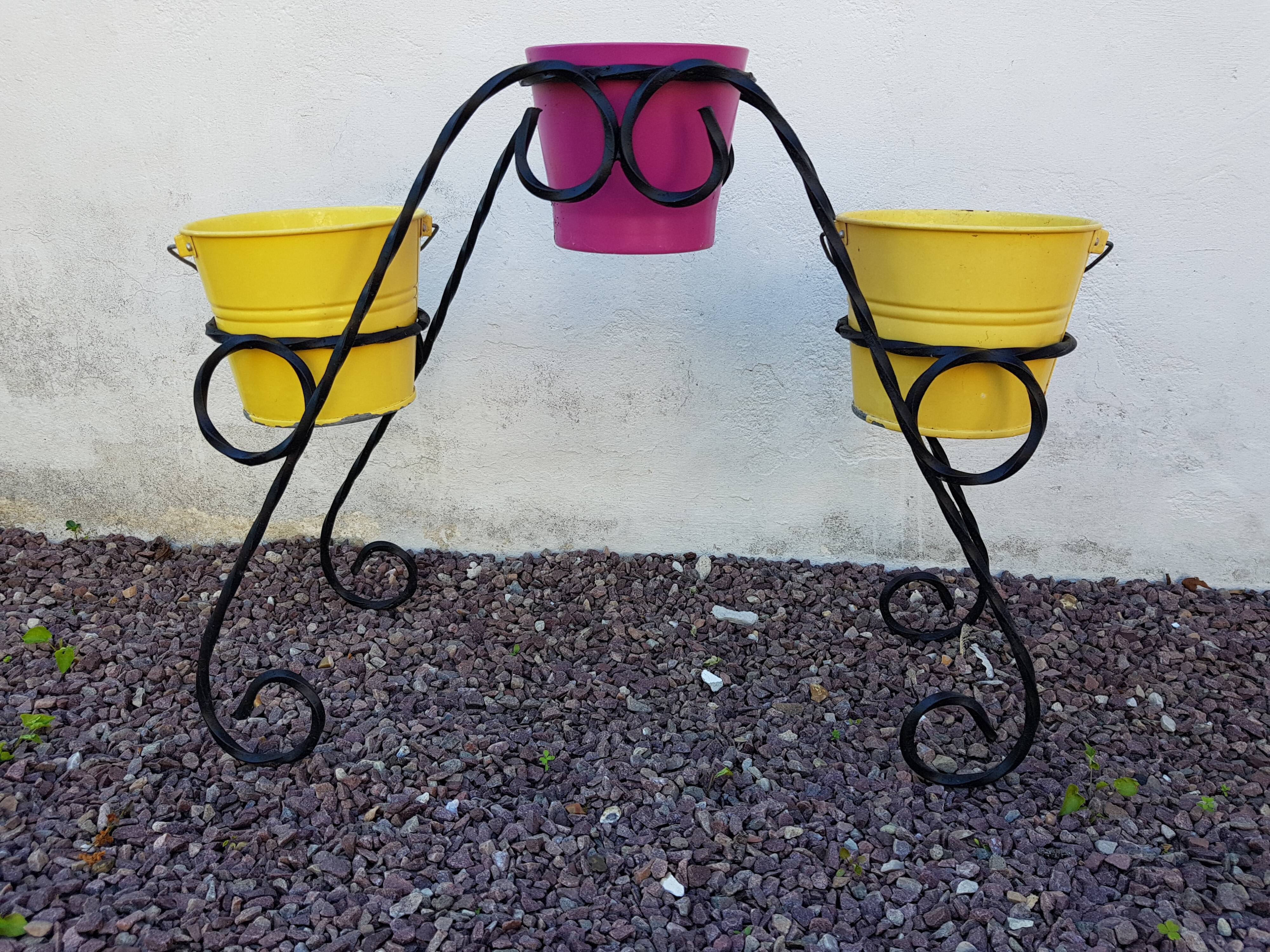 Black wrought iron plant holder
