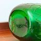 Italian carafe Empoli in iridescent green with diamond pattern.
