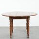 Antique English drop-leaf dining table made of walnut with elegant legs