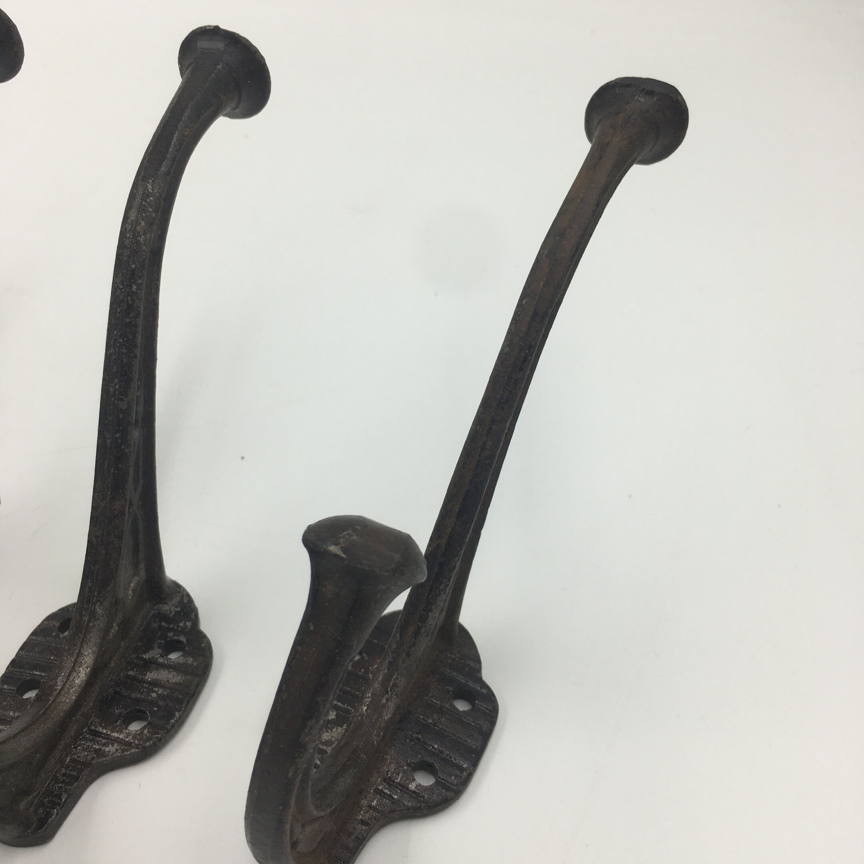 Set of 5 cast iron hooks early 20th