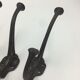 Set of 5 cast iron hooks early 20th