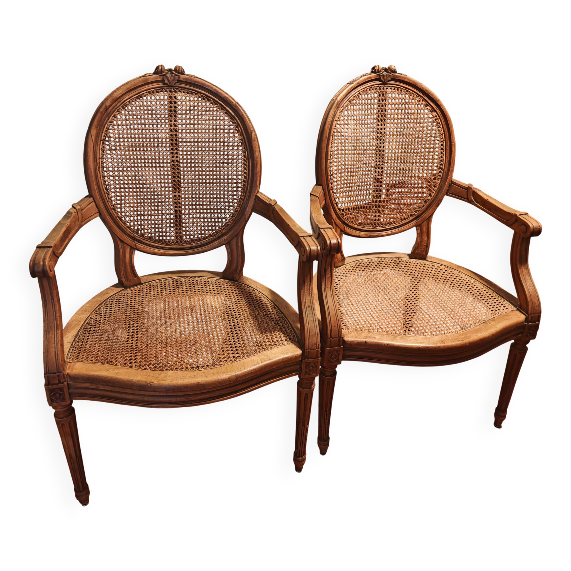 Caned armchairs