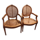 Caned armchairs