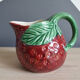 Strawberry-shaped slurry jug