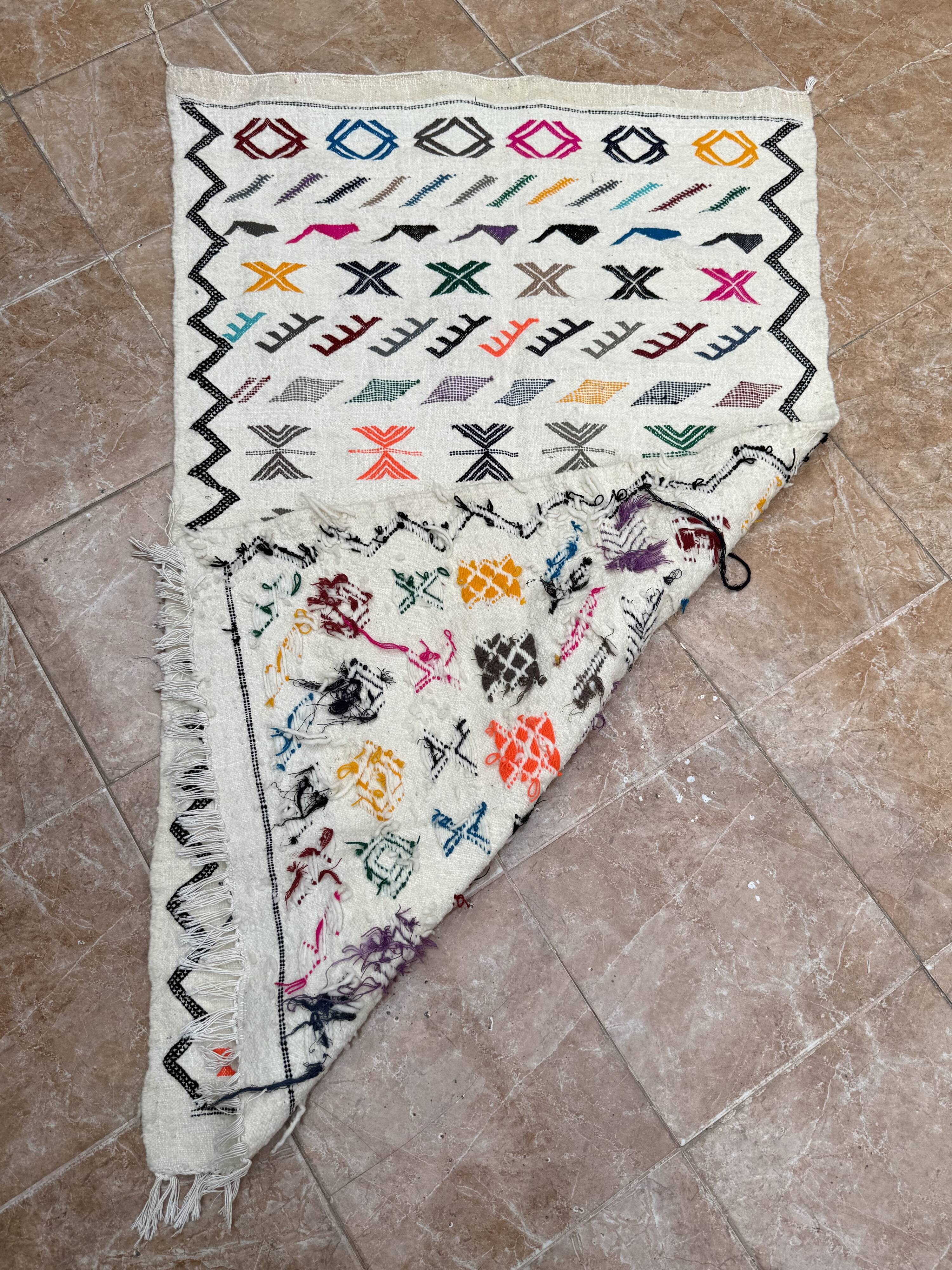 Handwoven Berber kilim rug: small Moroccan decorative rug.
