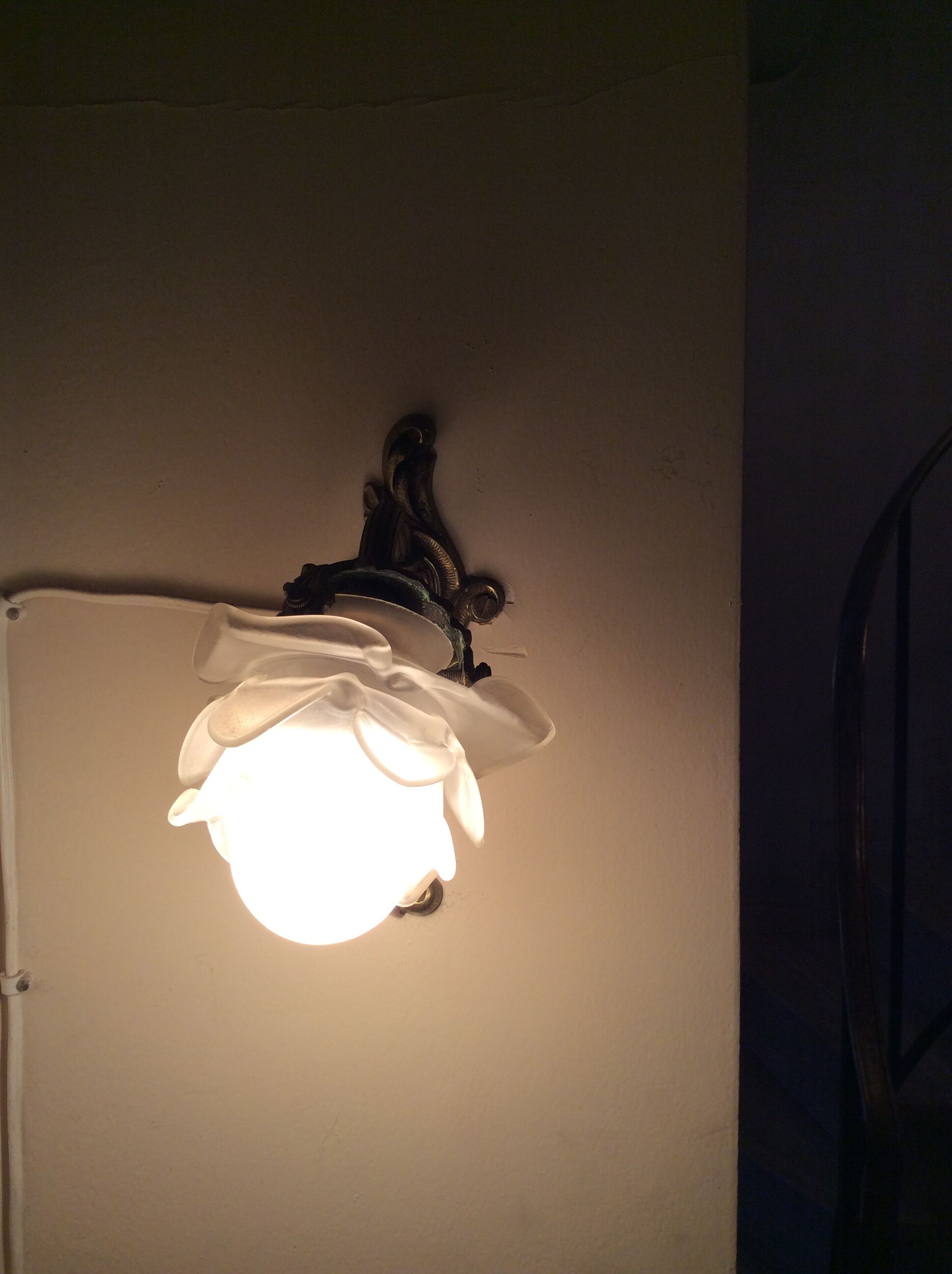 Old wall lamp in bronze and glass