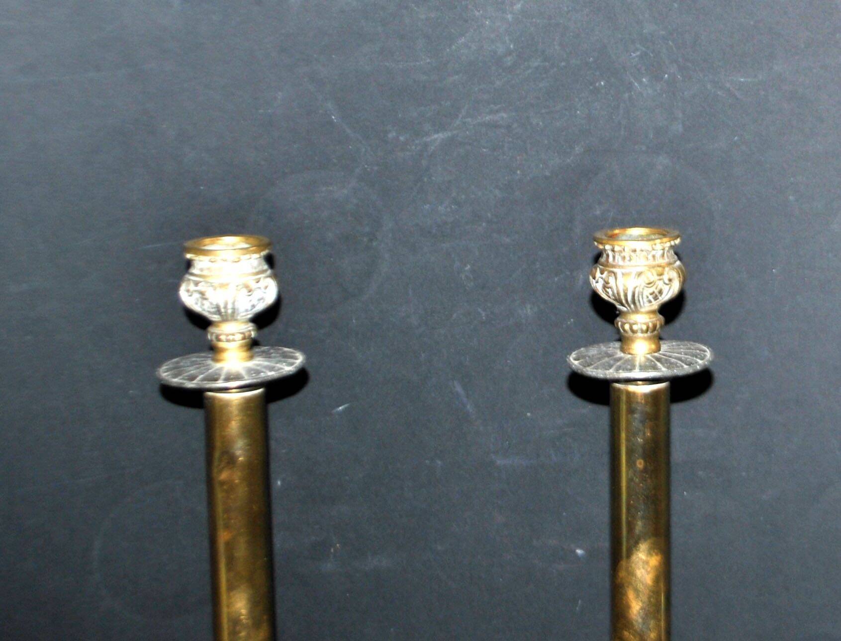 Lot of 2 antique brass and gilded bronze candle holders with acanthus decoration.