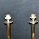 Lot of 2 antique brass and gilded bronze candle holders with acanthus decoration.
