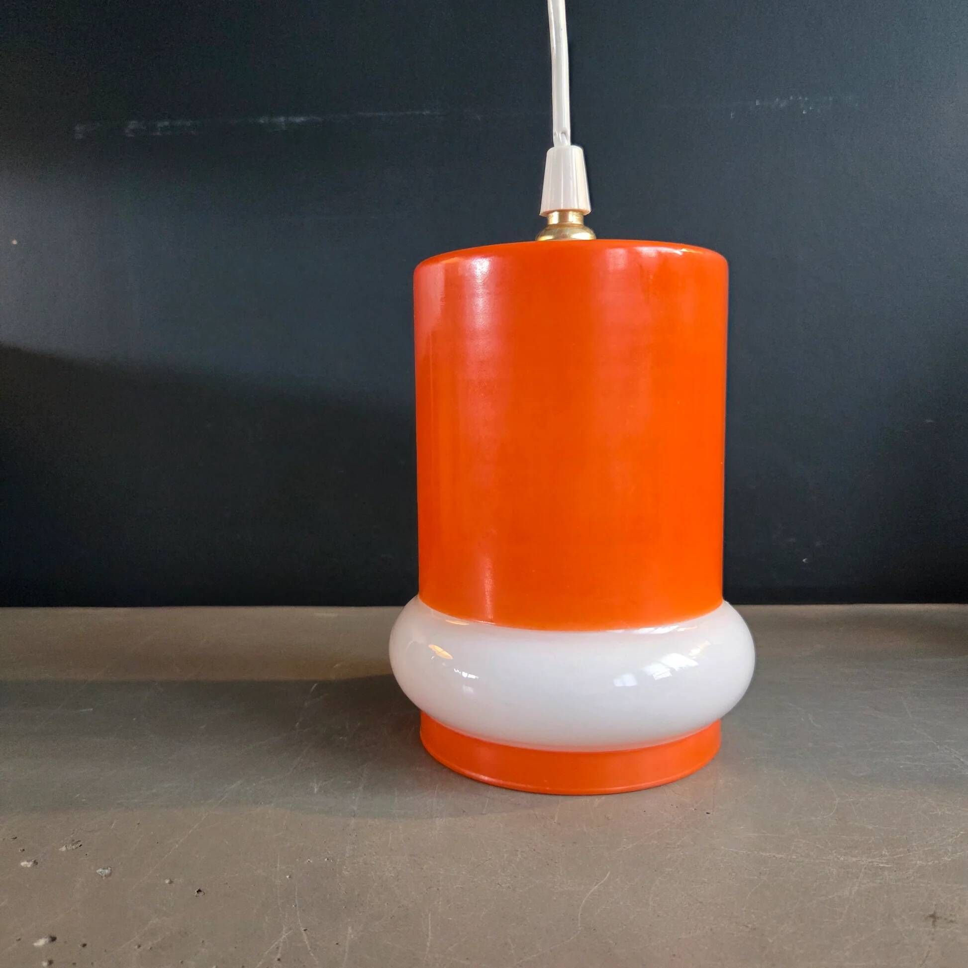 Vintage suspension in orange and white glass.