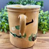 Large vintage ceramic pitcher with abstract green and brown decoration.