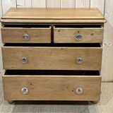 English chest of drawers in nineteenth century fir with its glass buttons