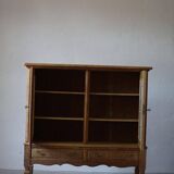 20th-century mid-century solid oak sideboard with glass front, by a Danish cabinetmaker.