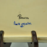 Under the plate and bottle signed Rouen collection art of the table