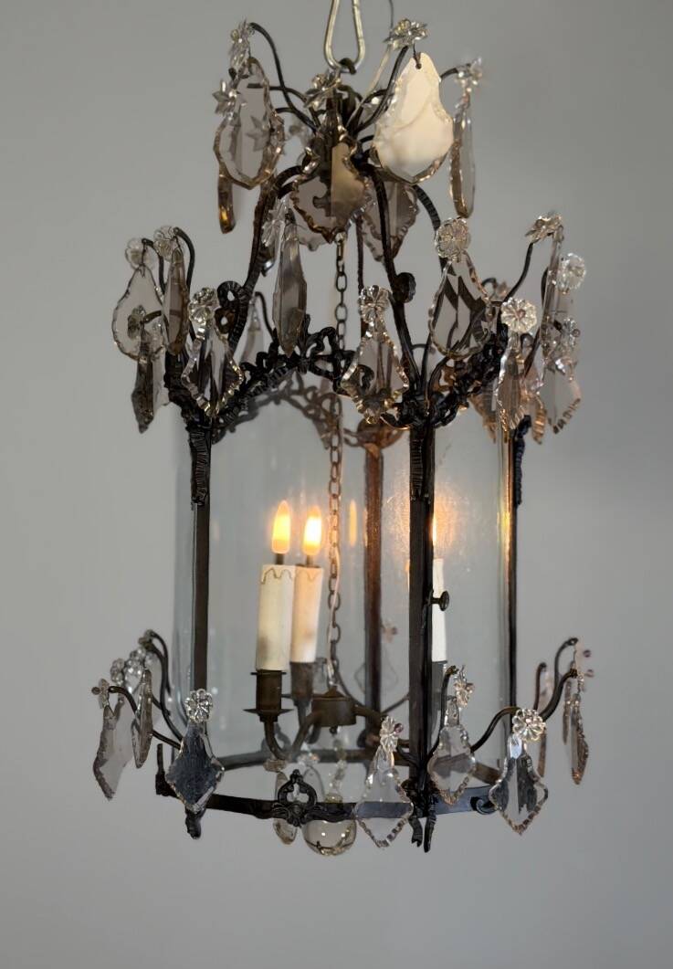 Louis XV style lantern in blackened brass adorned with cut crystal pendants, circa 1900.