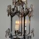 Louis XV style lantern in blackened brass adorned with cut crystal pendants, circa 1900.