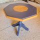 Octagonal wooden coffee table with central leg