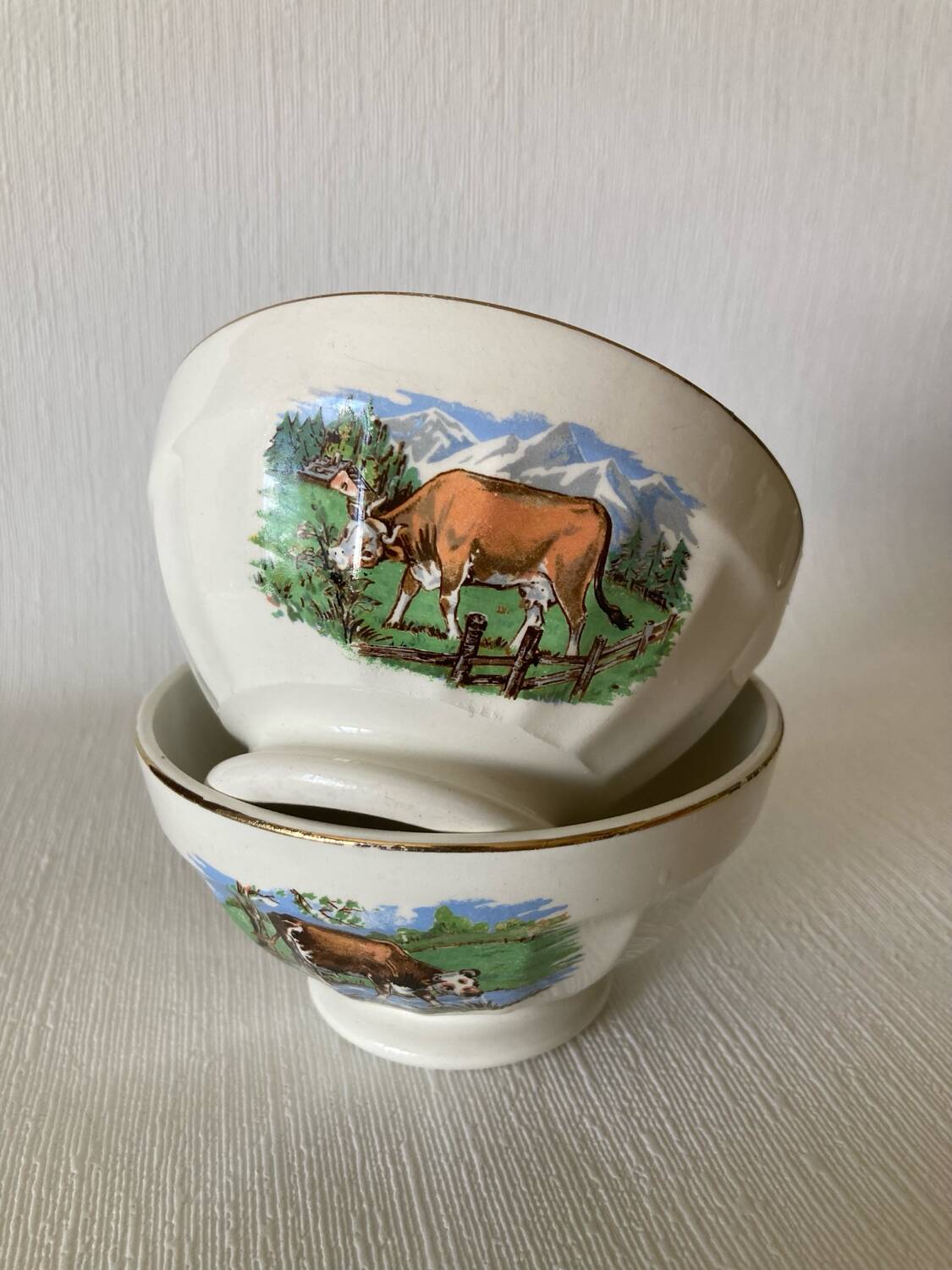 Pair of small faceted bowls with cow illustrations from the 40s and 50s