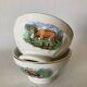 Pair of small faceted bowls with cow illustrations from the 40s and 50s