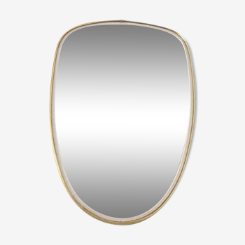 Free-form asymmetrical mirror from the 60s and 70s