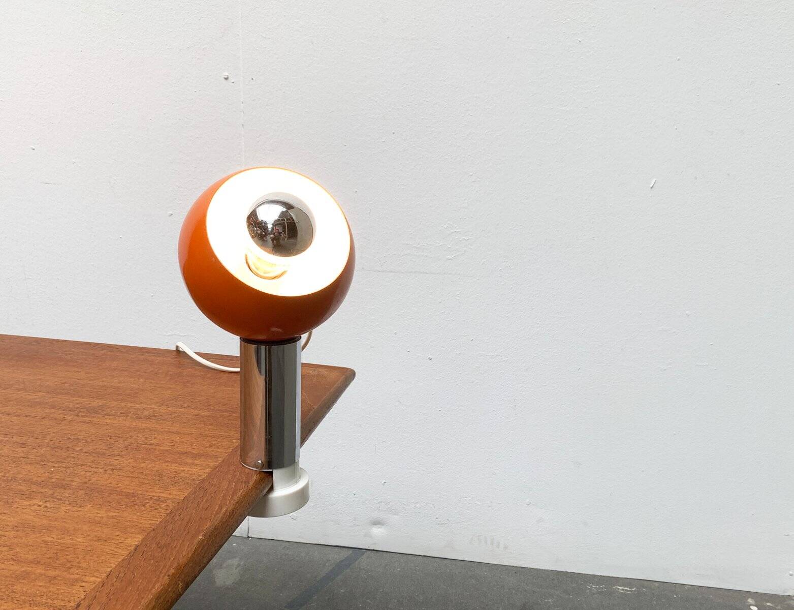 Mid-century space age magnetic clamp table or shelf lamp from the 1960s.
