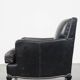 Armchair in black grained cowhide leather with a deep seat