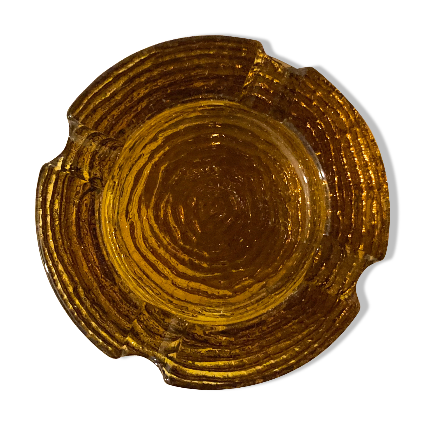 Empty chiseled pocket in amber glass