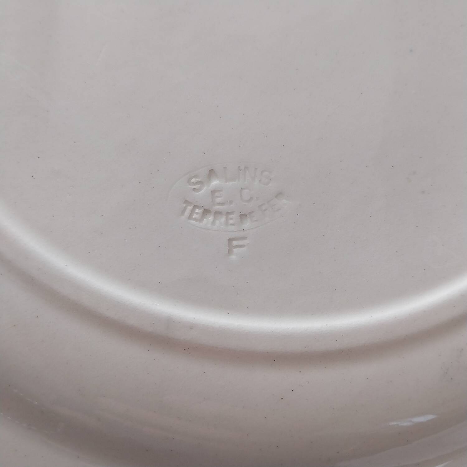 Old large iron earth dish Parmentier Salins